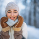 Portrait of happy woman in winter park